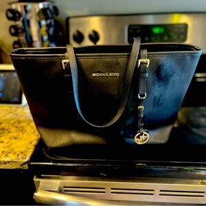 Michael Kors black leather handbag